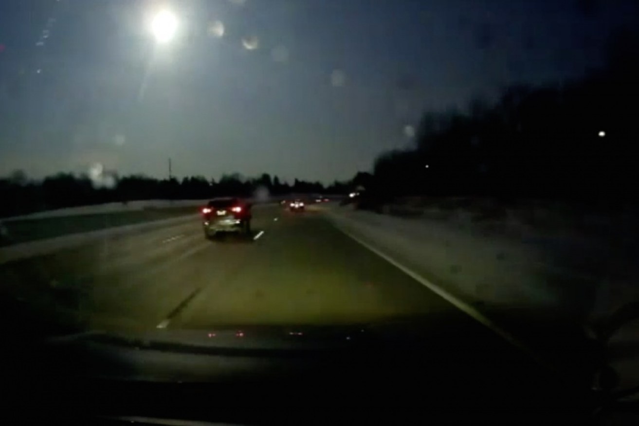 Motorist's dash-cam captures a meteor over Detroit.