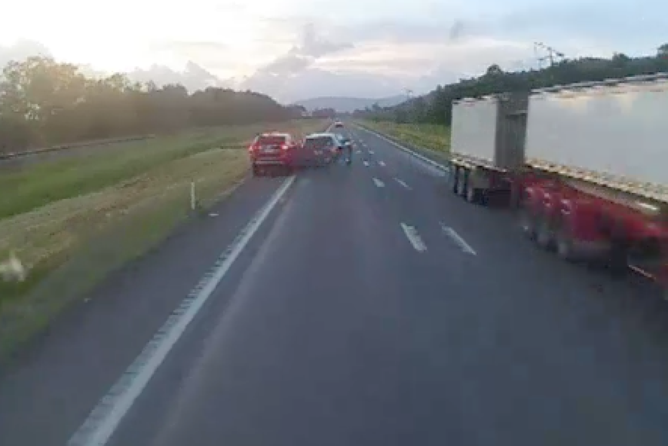 Dashcam footage shows a stolen car crashing into another vehicle on Bruce Highway.