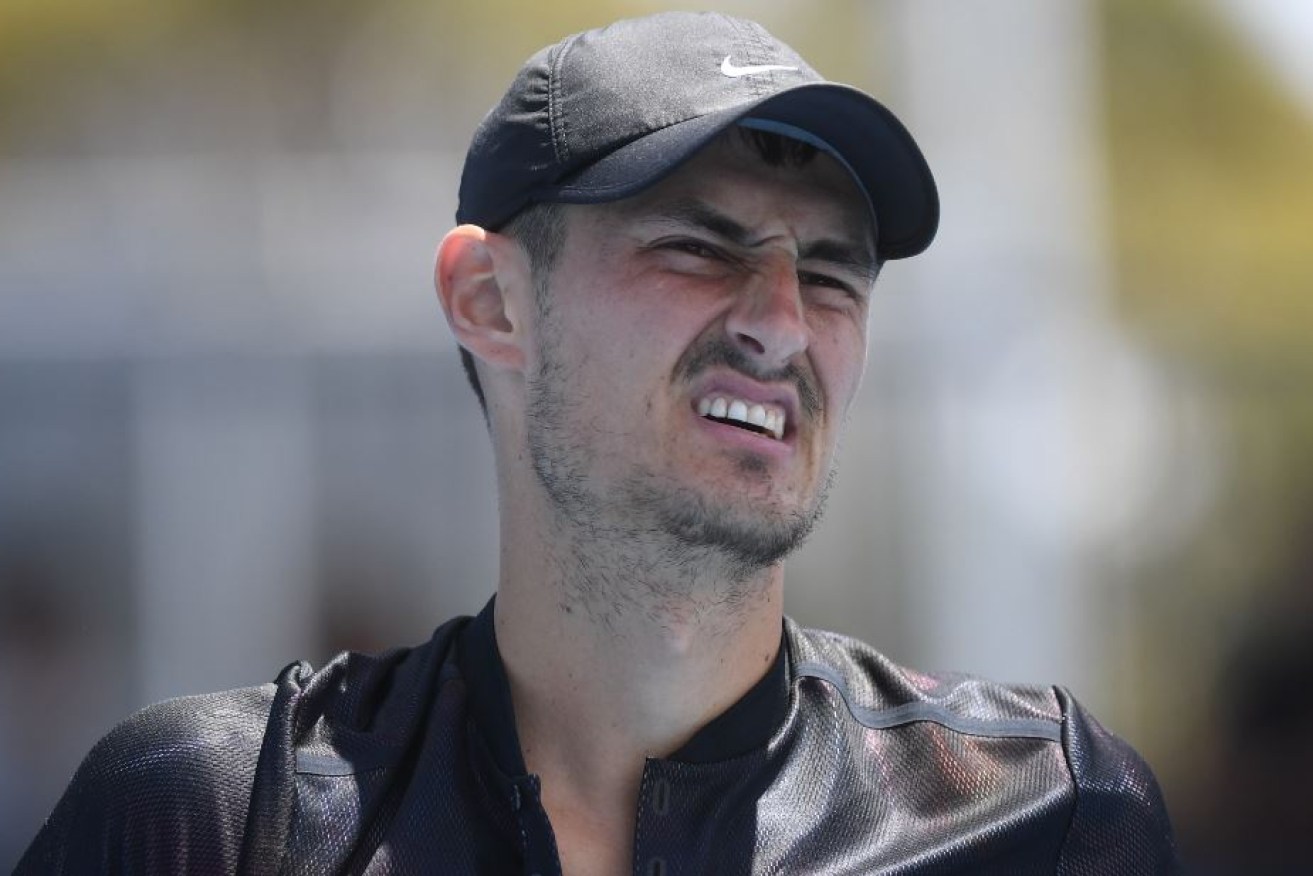 A surly Bernard Tomic had little to say after his shock defeat, but words weren't needed - that ugly grimace says it all.