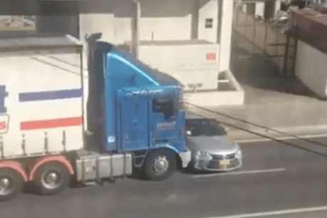 Footage emerges of truck pushing a car sideways along Sydney street