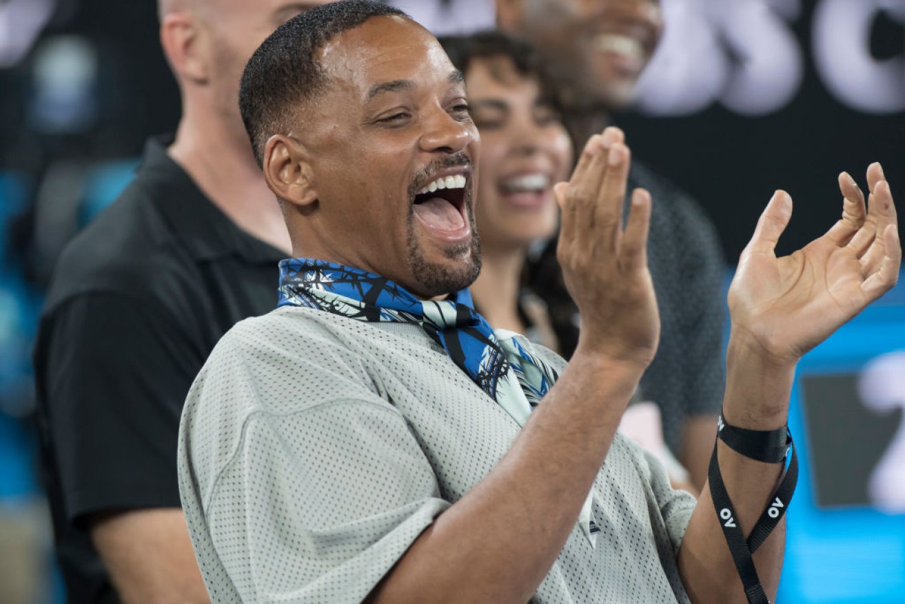 Actor Will Smith enjoys a laugh with Nick Kyrgios at the Australian Open.
