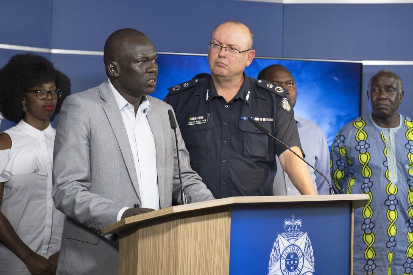 African community leader Richard Deng speaks alongside Victorian Chief Police Commissioner Graham Ashton earlier this month.