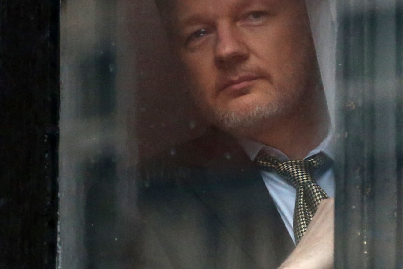 Authorities are investigating whether hidden devices were spying on Julian Assange while he was holed up in the Ecuadorian embassy. 