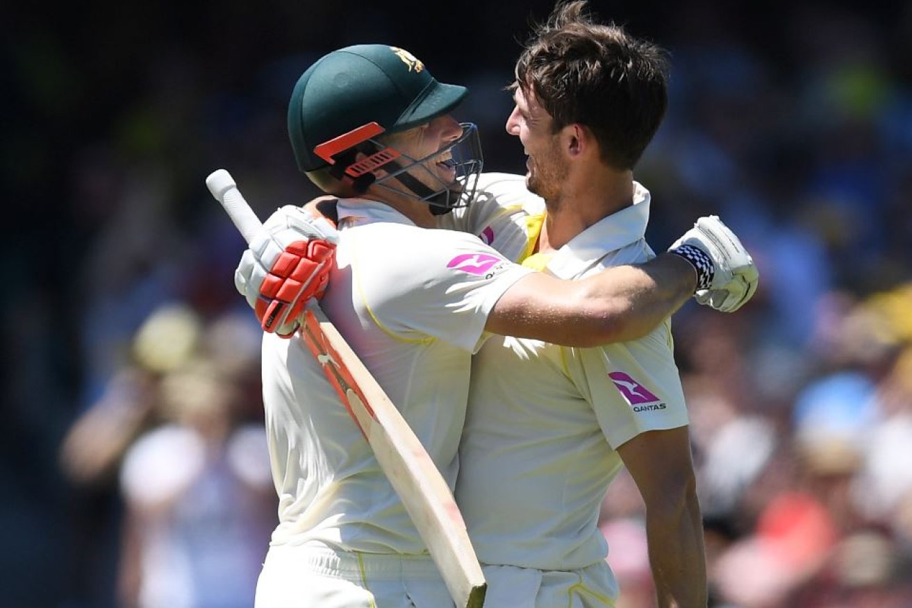Shaun and Mitchell Marsh fall into each other's arms, almost prompting a run-out disaster for Australia.
