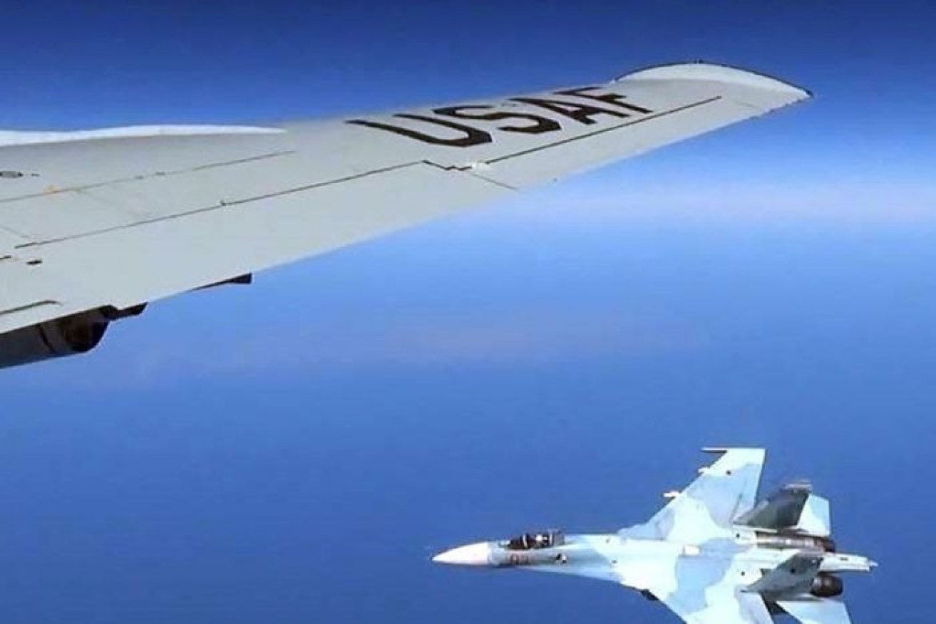 A Russian fighter alongside a US aircraft over the Baltic Sea. 