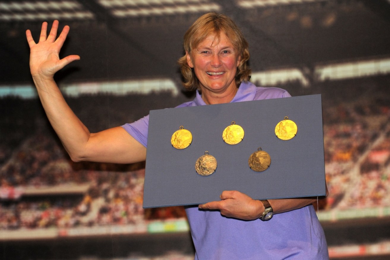 Olympic swimmer Shane Gould (pictured here with her Olympic medals) is a new member of the Order of Australia. 