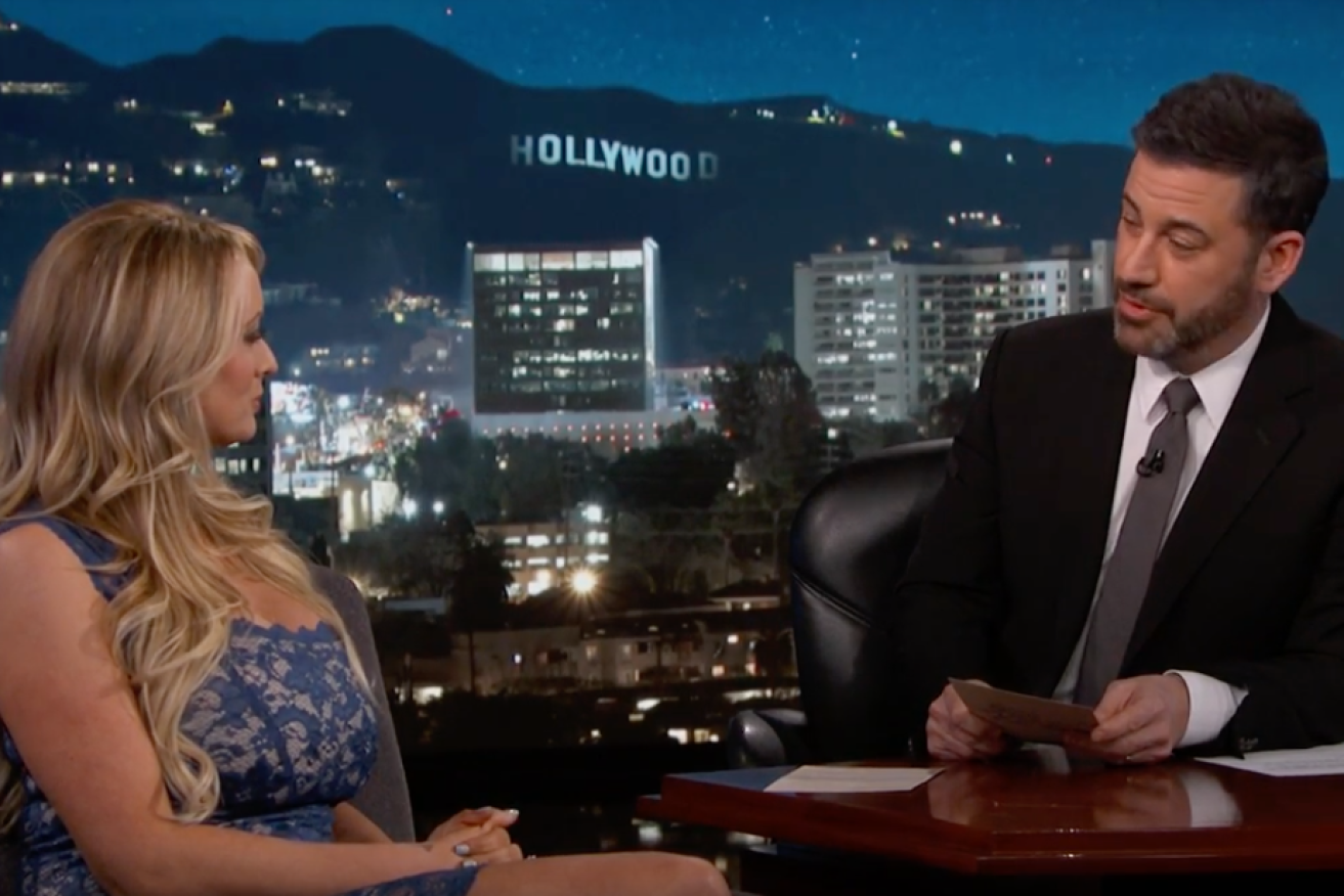 Adult film star Stormy Daniels (left) dodged probing questions from Jimmy Kimmel – but not without dropping a few hints. 