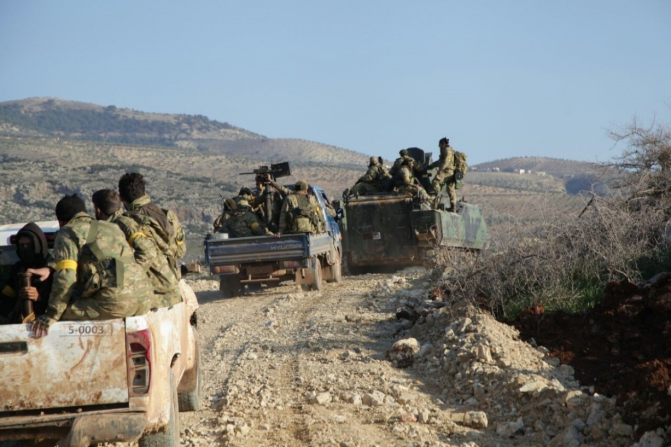 Free Syrian Army (FSA) members backed by Turkish army, on their way to Shaykh al-Hadid town of Afrin. 