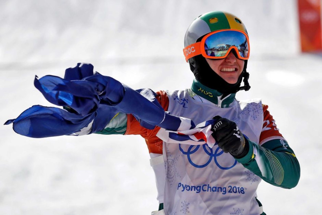 Jarryd Hughes celebrates with the Australian flag after winning his Olympic silver medal.
