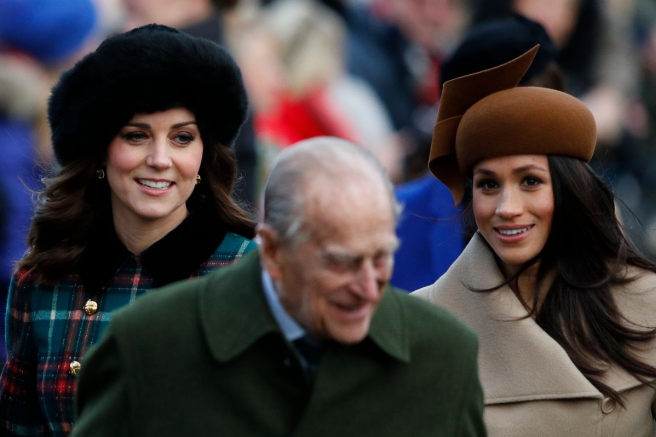 Kate and Meghan with the WIndsors on their first public outing together, Christmas 2017.