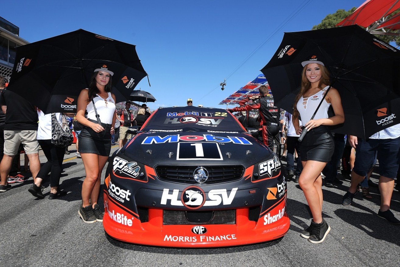 Grid girls pose for a photo at the Clipsal 500 in Adelaide.