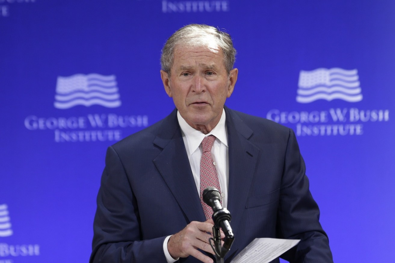 Former president George W Bush said the Russian president had a "chip on his shoulder".