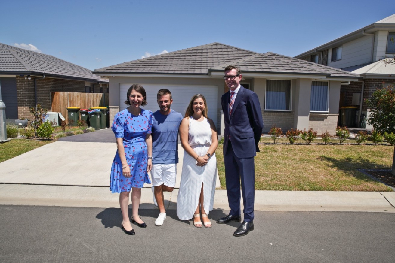 Premier Gladys Berejiklian and Treasurer Dominic Perrottet announce the results with two first home buyers.