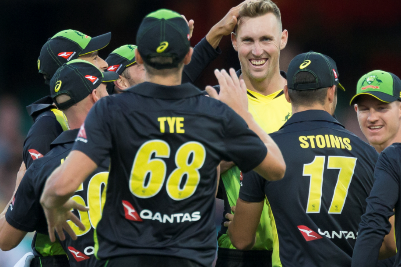 Billy Stanlake is mobbed by teammates after taking yet another Kiwi scalp.