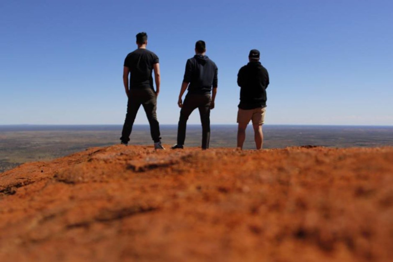 The climbers took this photo atop Uluru. Photo: Facebook