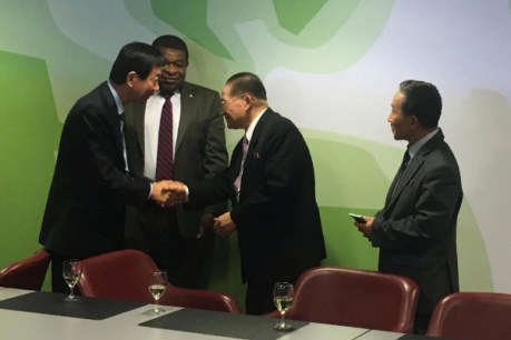 North, South Korean officials share historic handshake