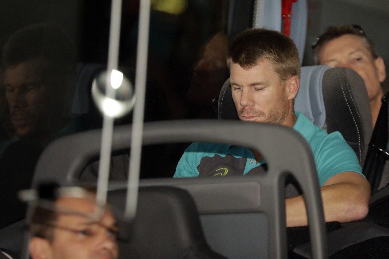 An isolated David Warner on the Australian team bus at Johannesburg airport on March 27.