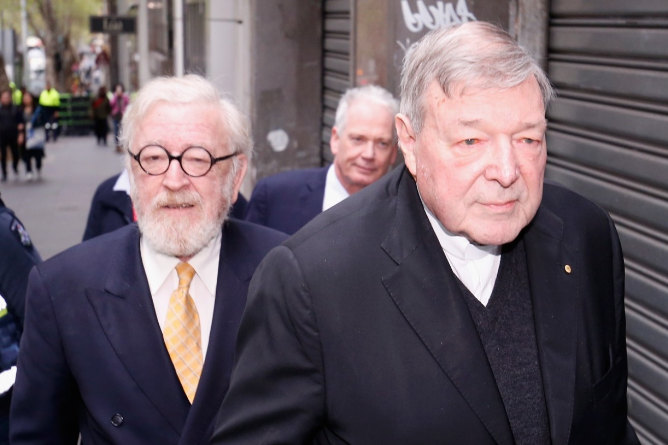 Cardinal George Pell (R) flanked by his barrister Robert Richter QC. 