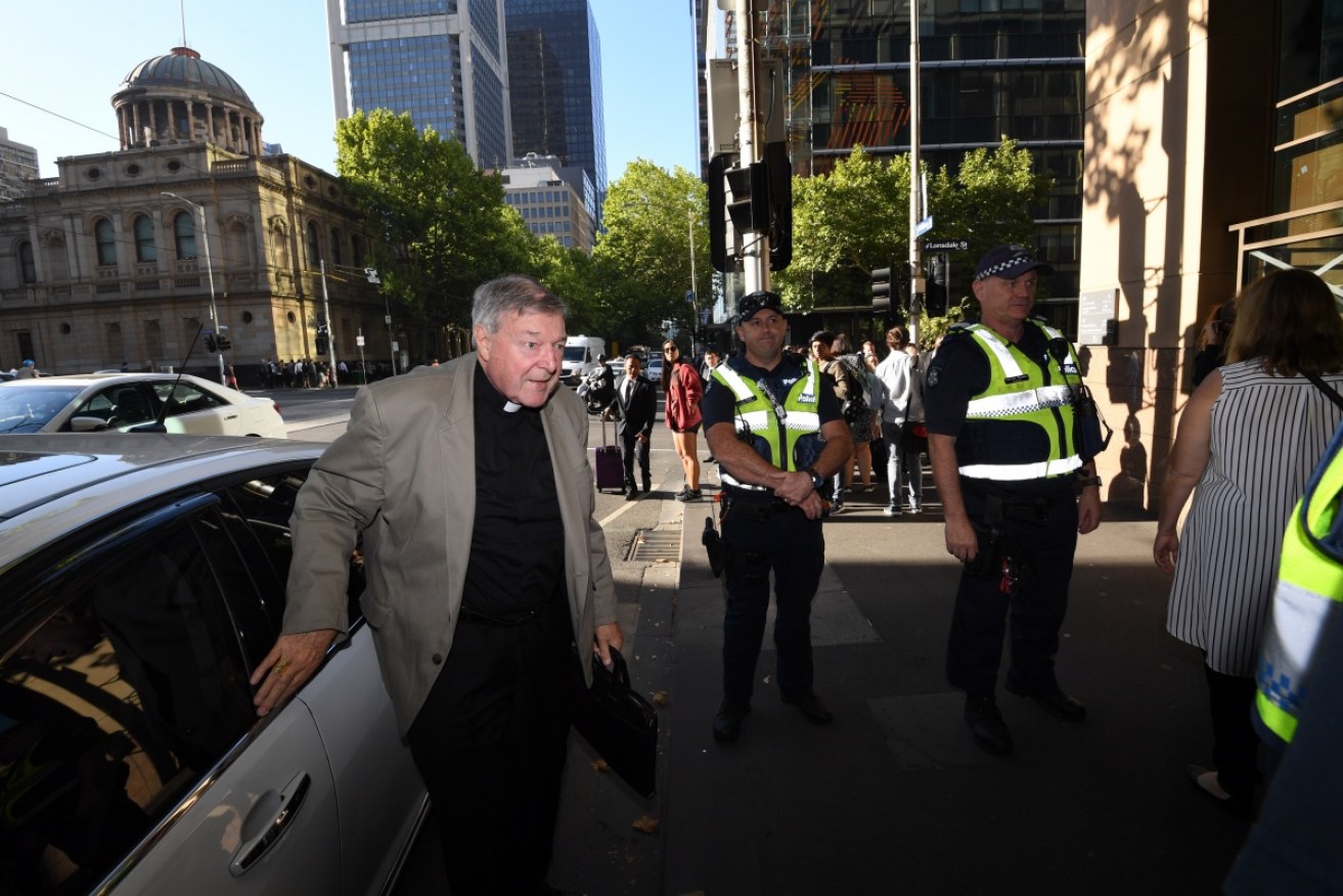 Cardinal George Pell arrives at court this week. 