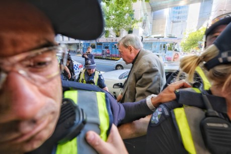 Cardinal George Pell arrives at court for historical sexual offences case