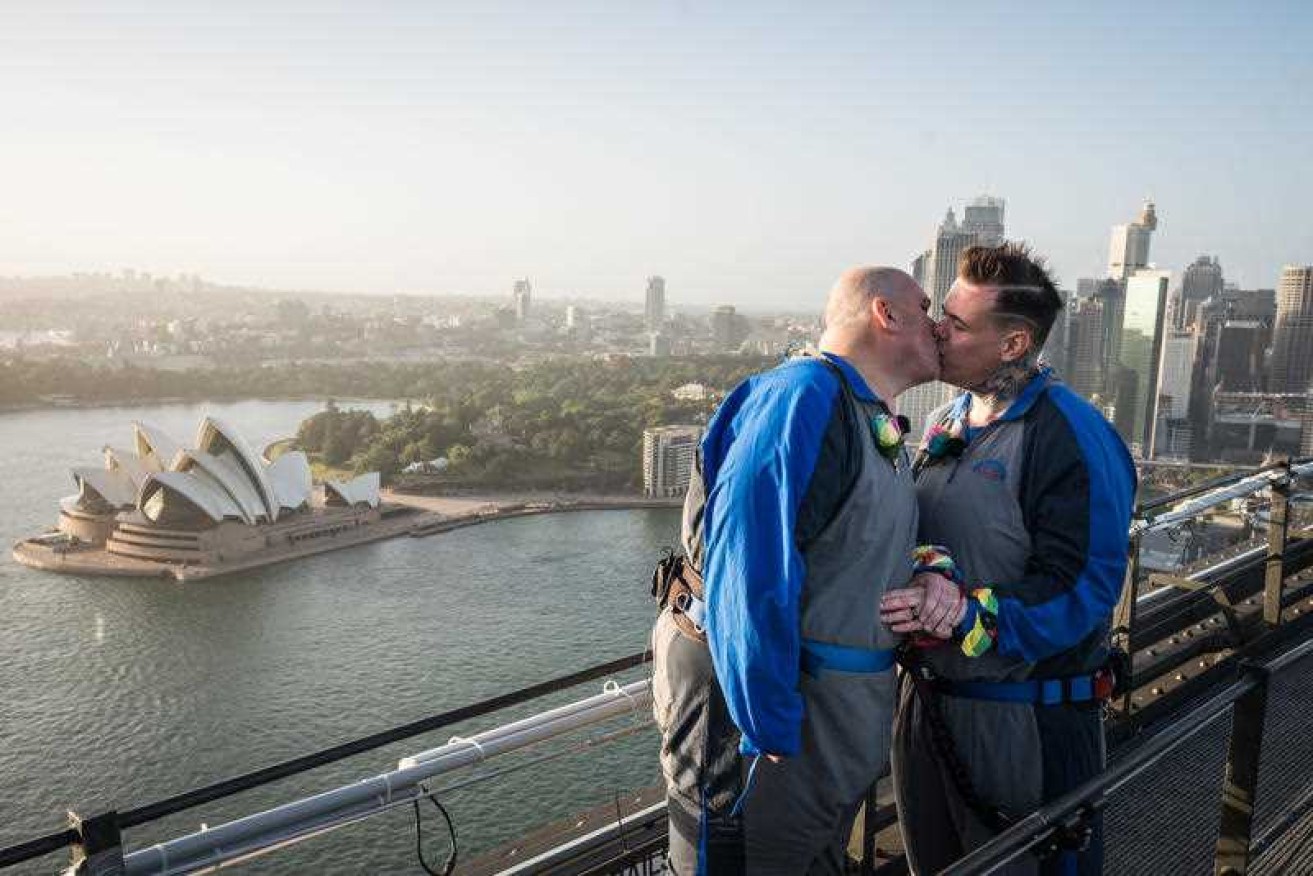 A supplied photograph of the wedding ceremony of Paul Phillips and Warren Orlandi on top of the Sydney Harbour Bridge.