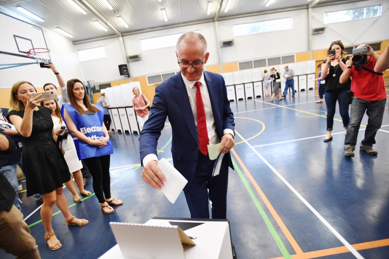 Premier Jay Weatherill is ahead in the polls as he casts his vote on Saturday.