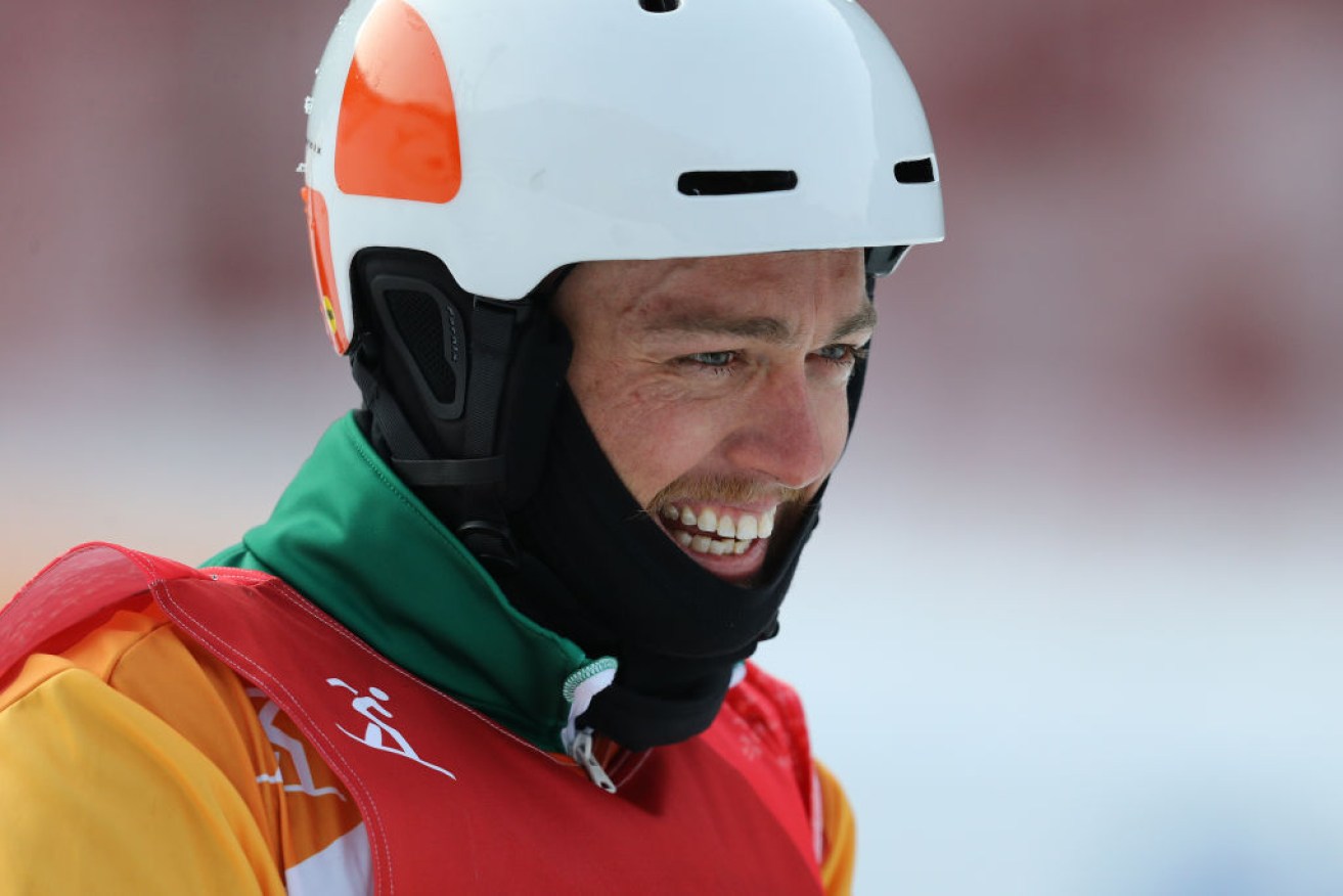 Simon Patmore is all smiles after winning the gold medal in the Men's Snowboard Cross SB-UL.
