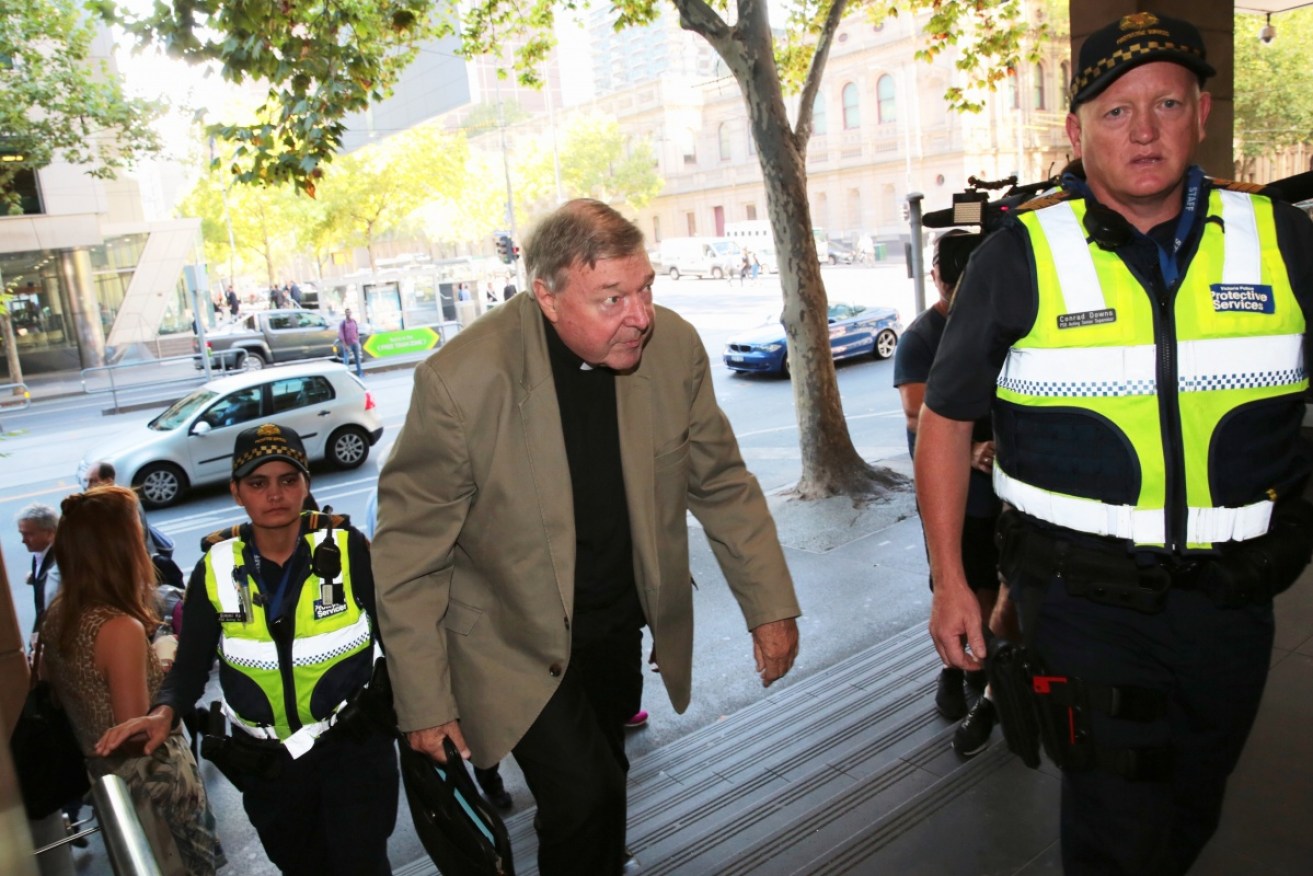 Catholic Cardinal George Pell arrives at the Melbourne Magistrates Court on Friday. 