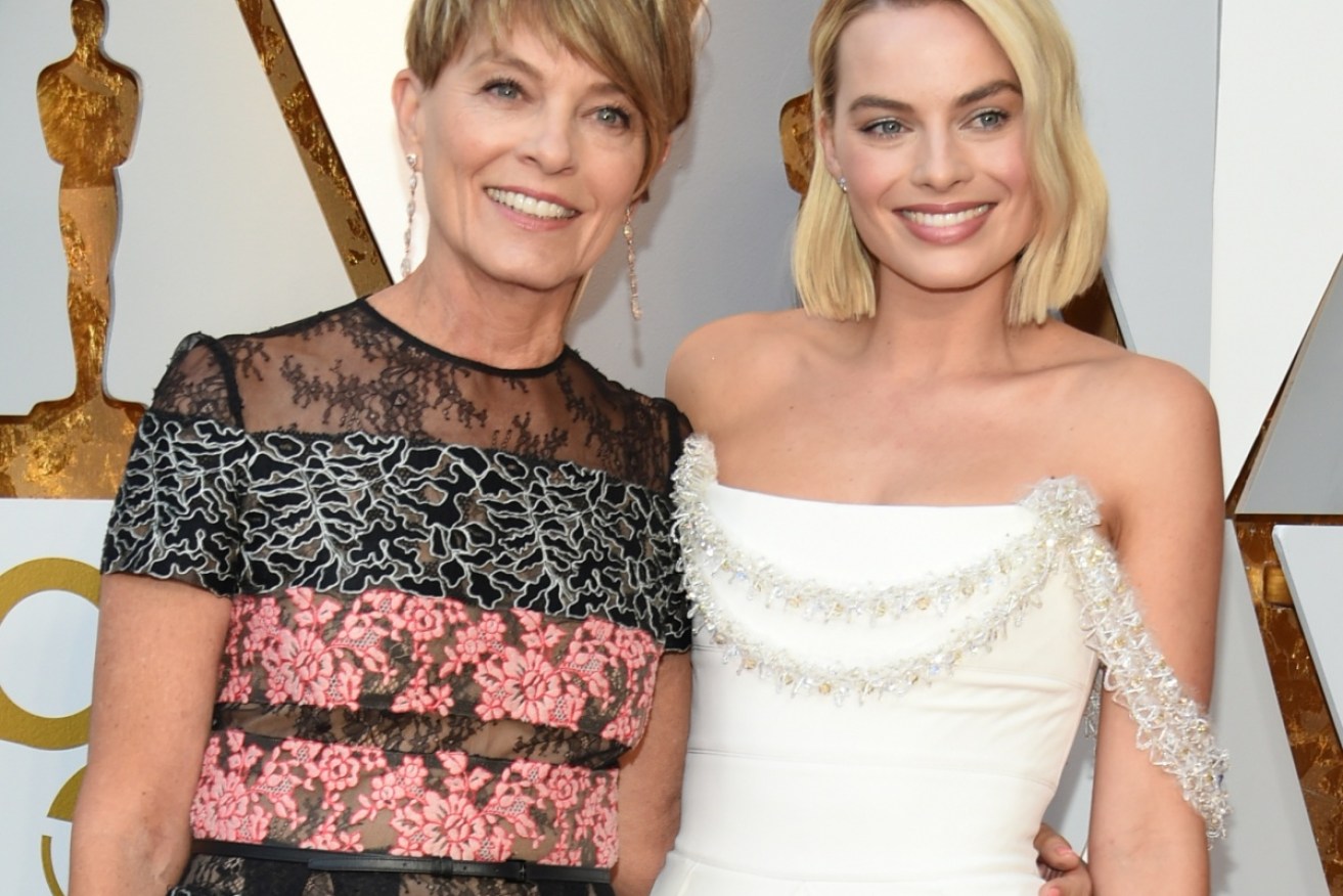 Margot Robbie (with mother Sarie Kessler) wanted her Chanel dress to be “couture ... but also cool," said her stylist Kate Young.