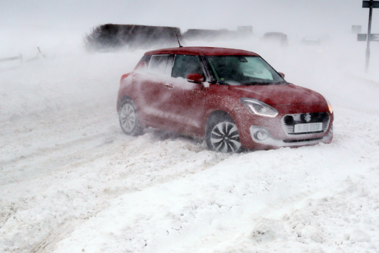 This snow-stalled car in England is going nowhere fast, just like the rest of Europe.