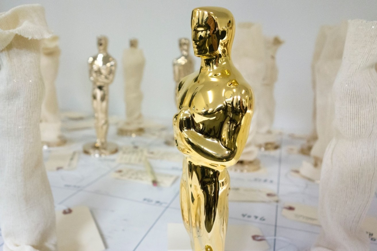 The Oscar statue is of a knight holding a crusader's sword standing on a reel of film with five spokes signifying the five original branches of the Academy including actors, directors, producers, technicians and writers. 