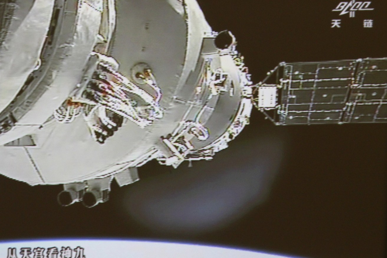 The Shenzhou-9 spacecraft (right) docks with the Tiangong-1 lab module (left) in 2012.