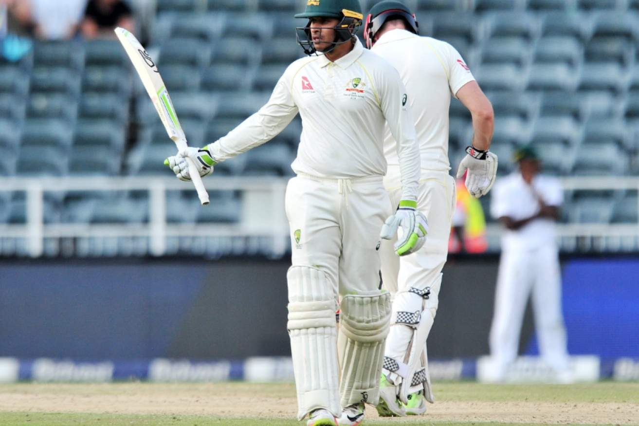 Usman Khawaja acknowledges the crowd's light applause for his half-century. Minutes later he would be gone.