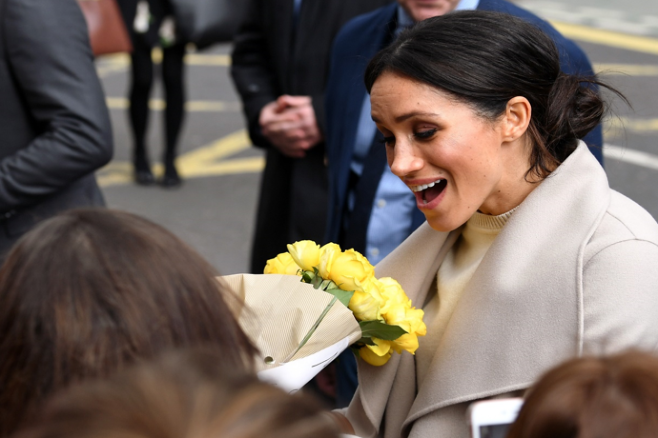 Meghan Markle is presented with a bouquet, but the white arrangements at her wedding will be of her choosing.