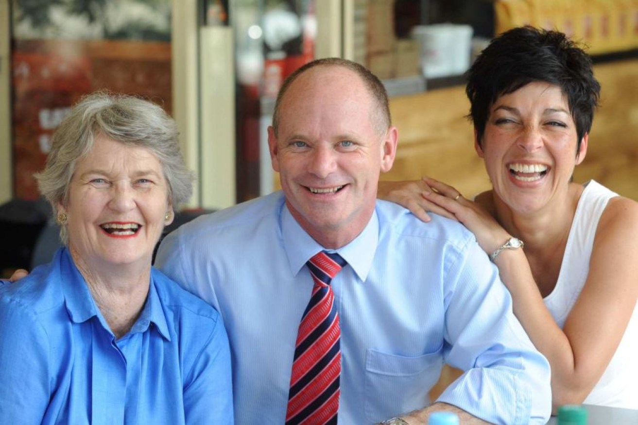 Jocelyn Newman, with son Campbell Newman and his wife Lisa, served as Social Services Minister for five years.