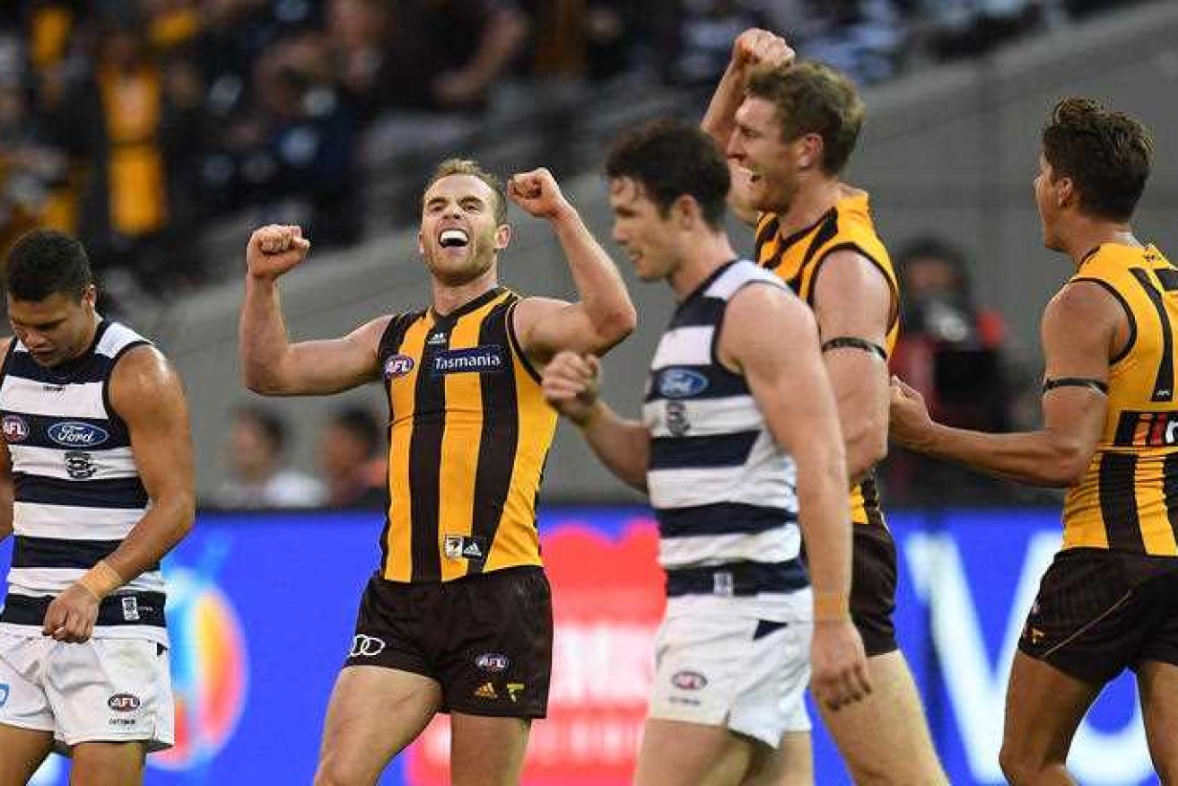 Tom Mitchell, who dominated again with 40 disposals, celebrates an epic victory over Geelong.