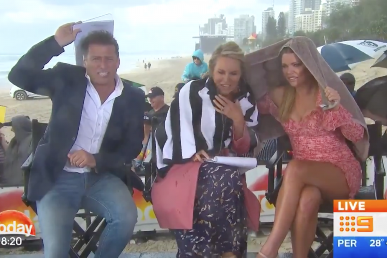 Karl Stefanovic, Georgie Gardner and Sophie Monk cowered under towels while filming <i>Today</i> on the Gold Coast.