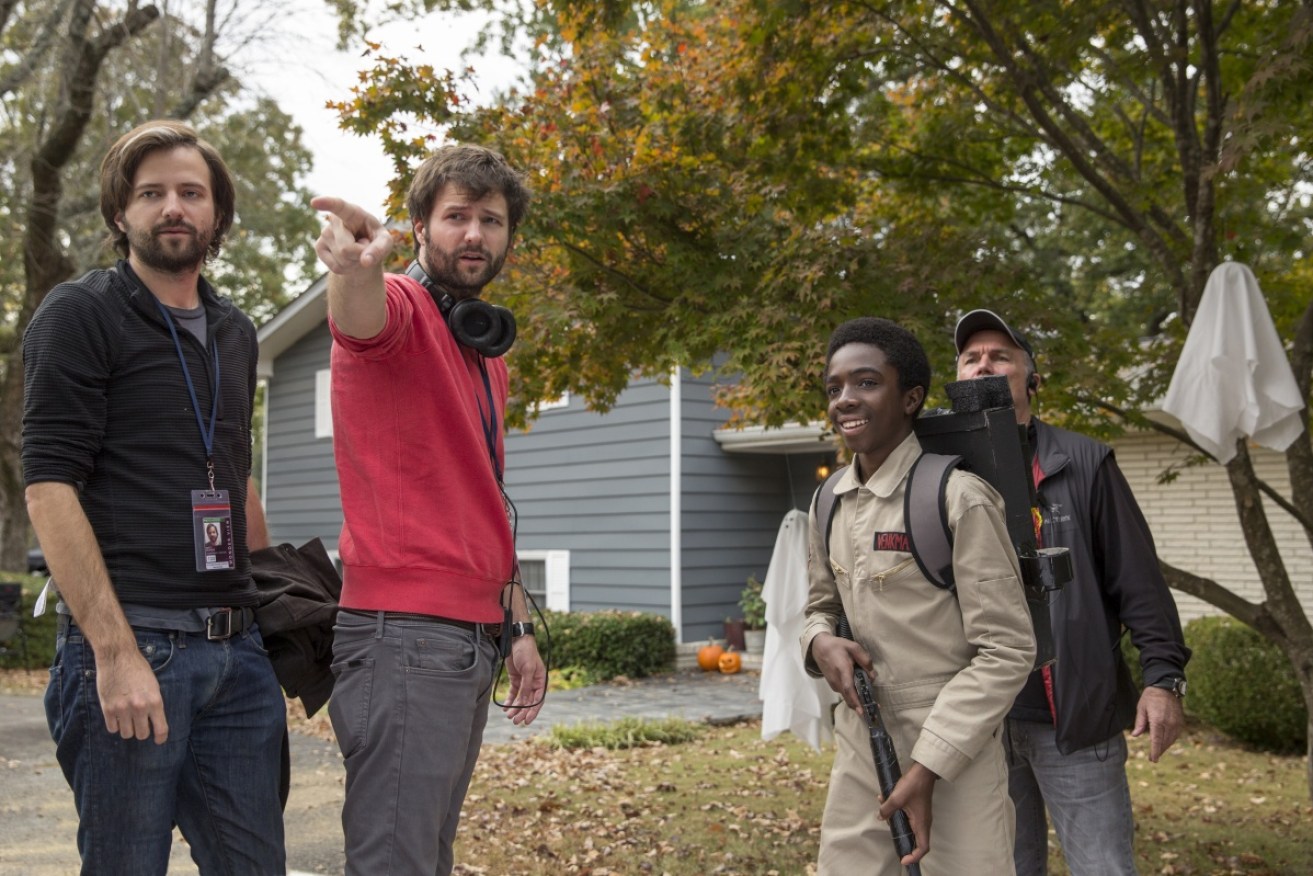 <i>Stranger Things</i> creators Matt (left) and Ross Duffer (centre) with actor Caleb McLaughlin on the show's set.