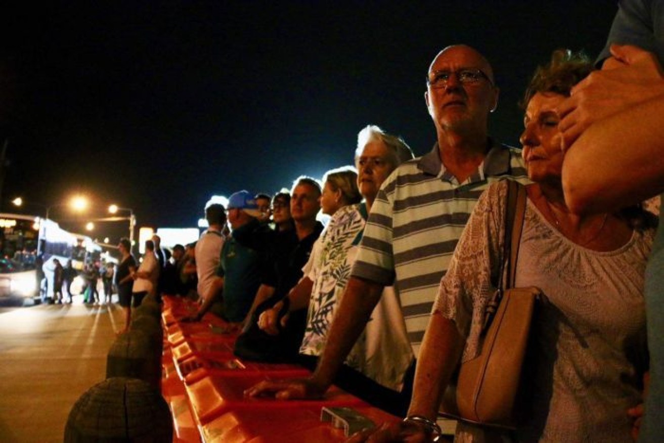 The long wait for buses to Carrara Stadium continued after dark.