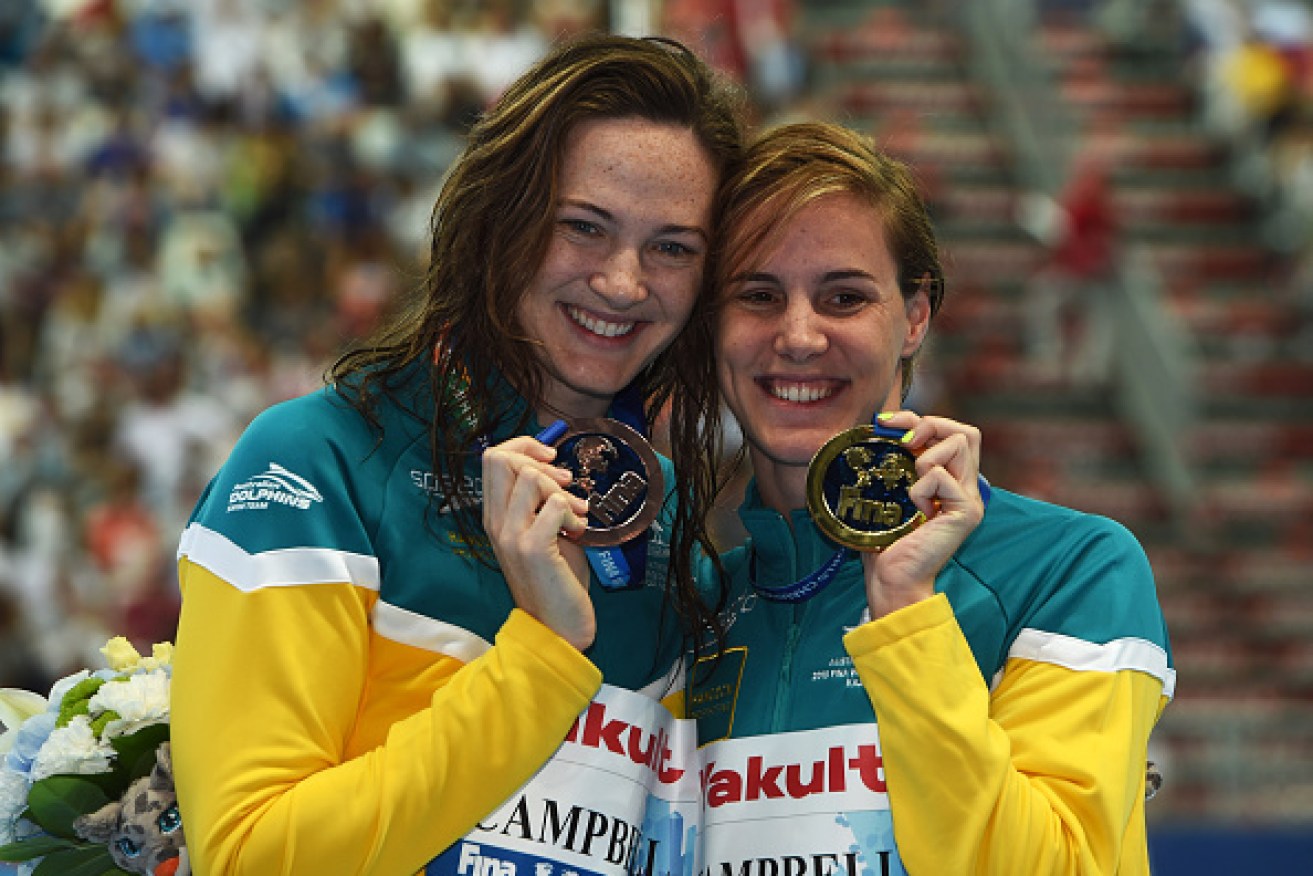 Campbell sisters celebrate after winning gold and bronze in the Women's 100m Freestyle final at the FINA World Championships. 