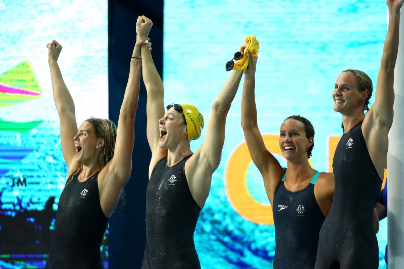 Australia's women's 4x100m freestyle relay team savour the moment of breaking their own world record.