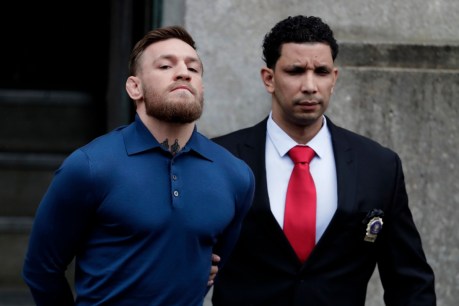 Handcuffed Conor McGregor charged with assault in NYC