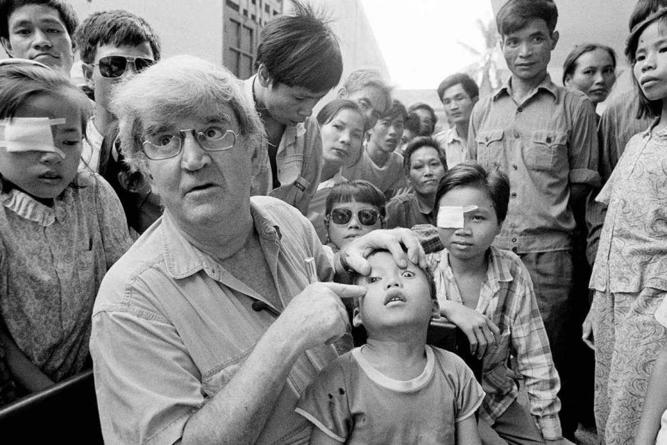 The iconic image of a young Tran Van Giap with Fred Hollows in Vietnam.