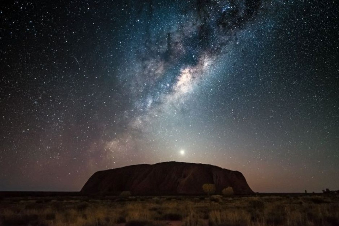 Uluru under the Milky Way.