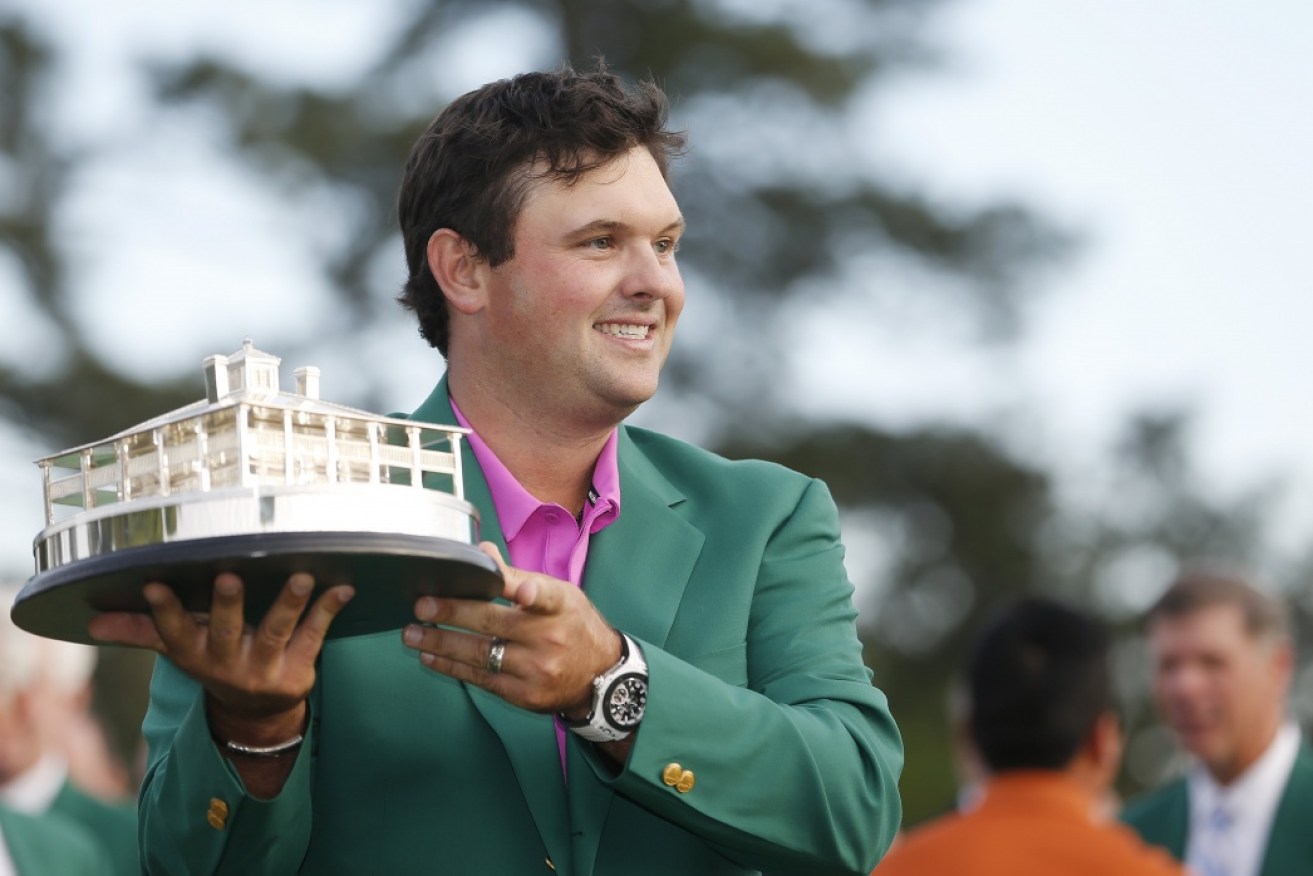 Reed held off a storming finish from Rickie Fowler to claim the green jacket.