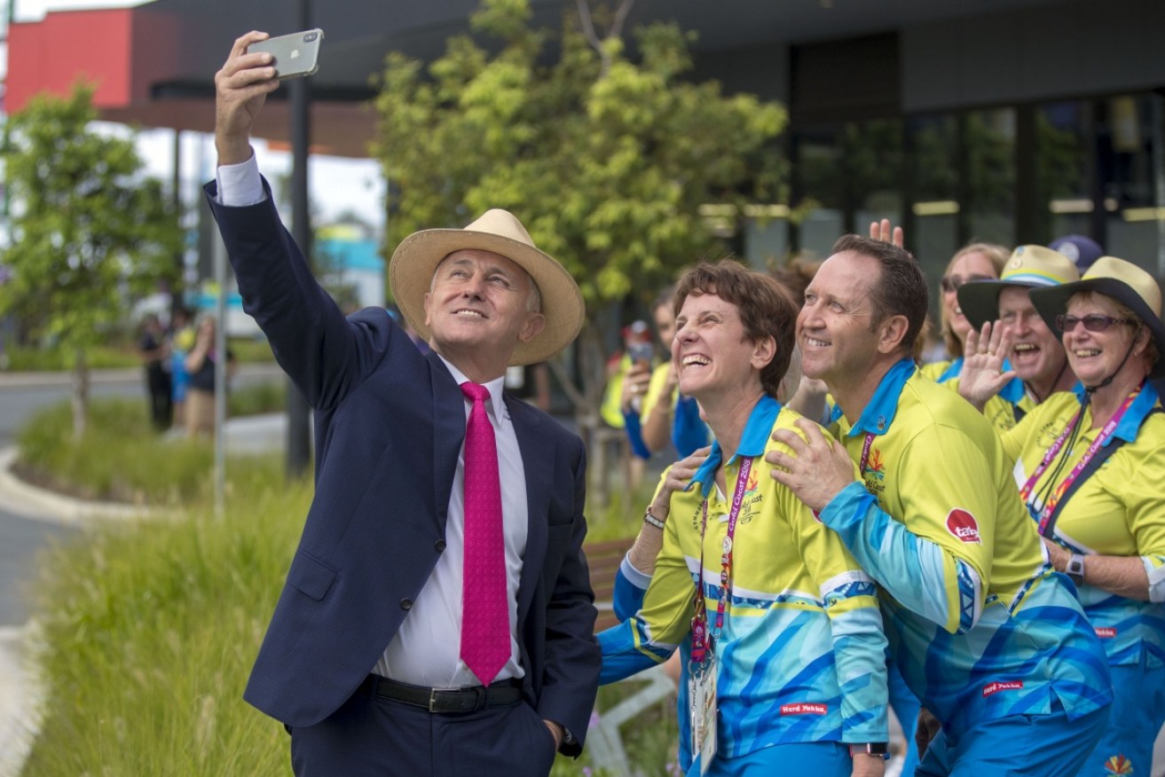 Mr Popular: Malcolm Turnbull takes a selfie with Commonwealth Games athletes. The PM had lost 30 Newspolls by the time the Games were over. 