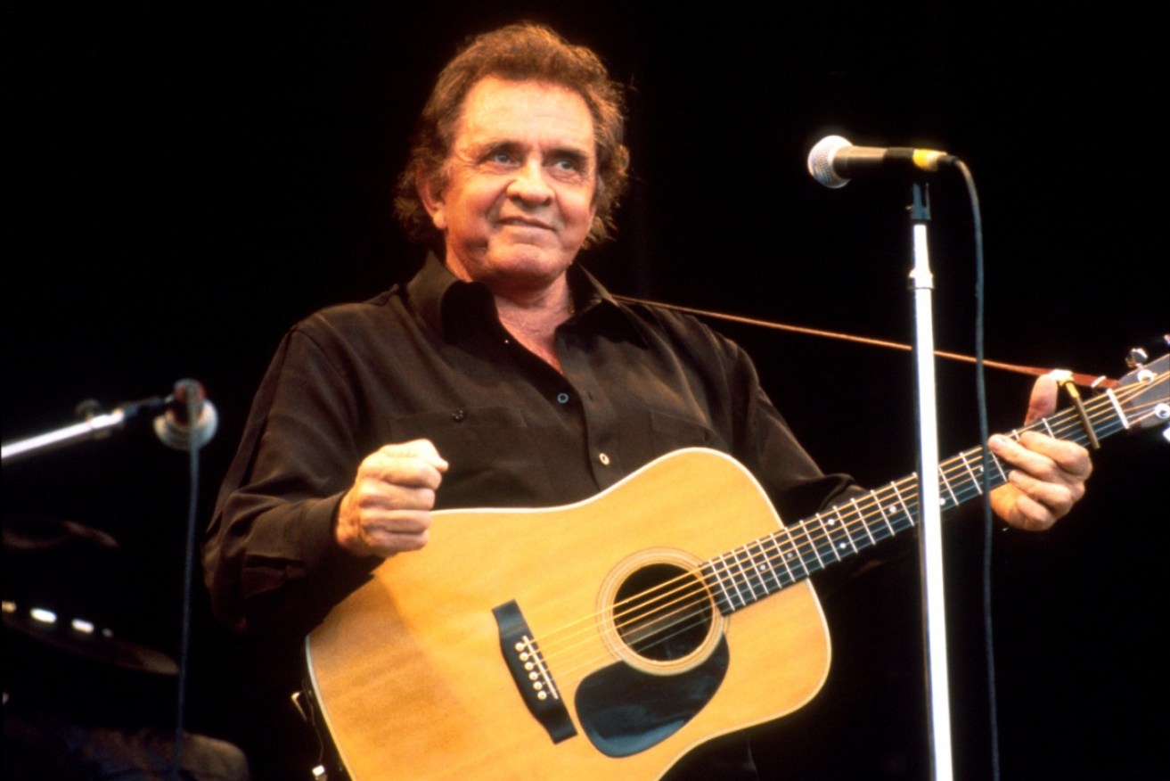 Johnny Cash playing at the Glastonbury Festival in 1994.
