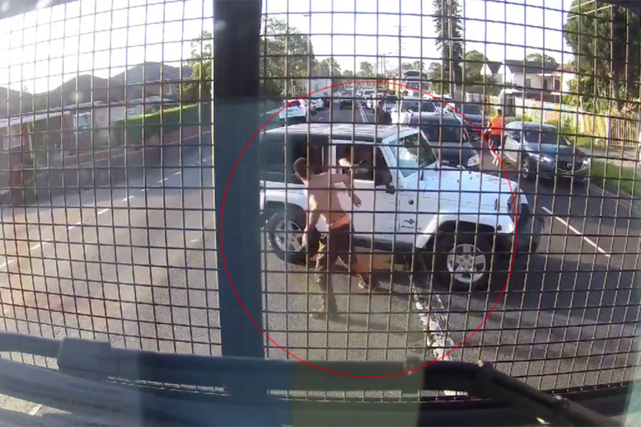 The incident began when the shirtless man threw punches at another driver.