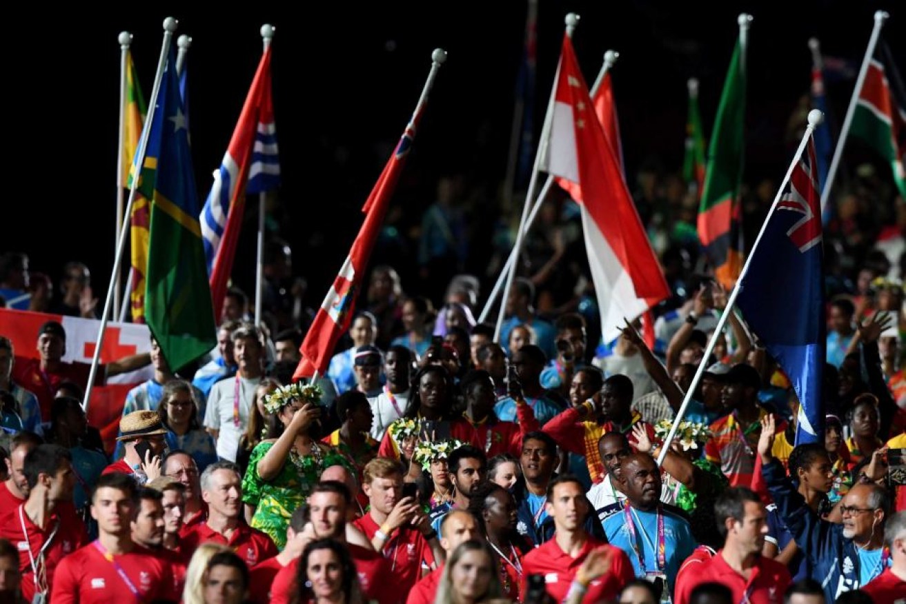 Athletes are seen before the start of the closing ceremony.