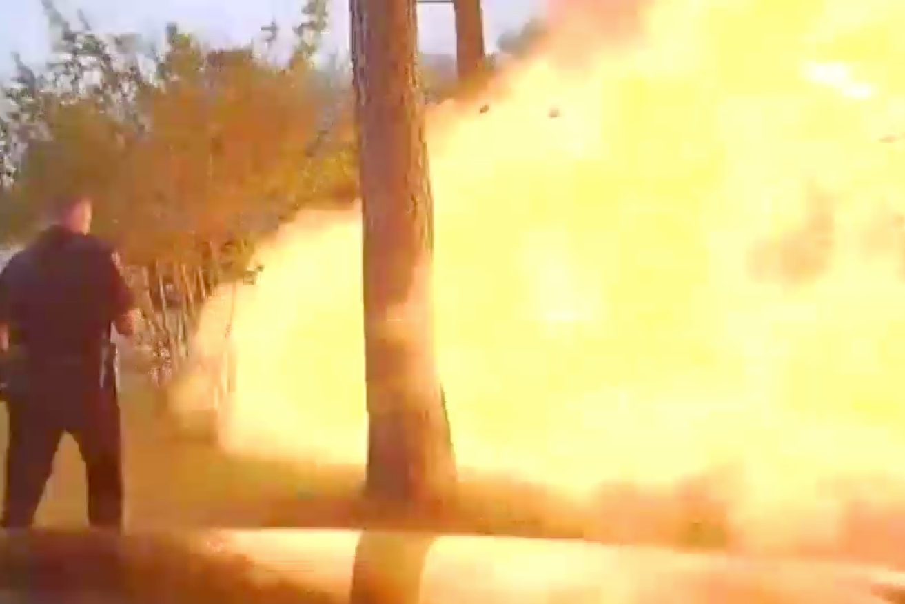 Police dashcam footage shows moment house explodes.